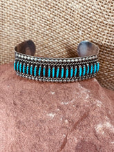 Load image into Gallery viewer, Sterling Cuff Bracelet with 22 Needlepoint Turquoise Stones crafted by Jason Yazzie
