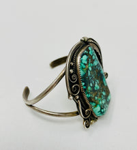 Load image into Gallery viewer, Heavy Navajo Cuff with Raindrops and Stampwork on Leaves Surrounding Stunning Turquoise Stone
