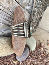 Load image into Gallery viewer, Large Navajo Sterling Silver Cuff featuring an enormous Turquoise Stone and 5 Hand Pulled Shanks
