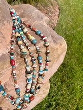 Load image into Gallery viewer, There is Turquoise, Coral, Hubble Glass Beads, Lapiz, Sterling Silver beads, and Stones all strung together
